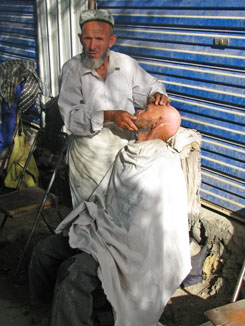 Hotan Market - I Wanted to Have My Head Shaved by Him, but He was too Busy Hotan Market - I Wanted to Have My Head Shaved by Him, but He was too Busy